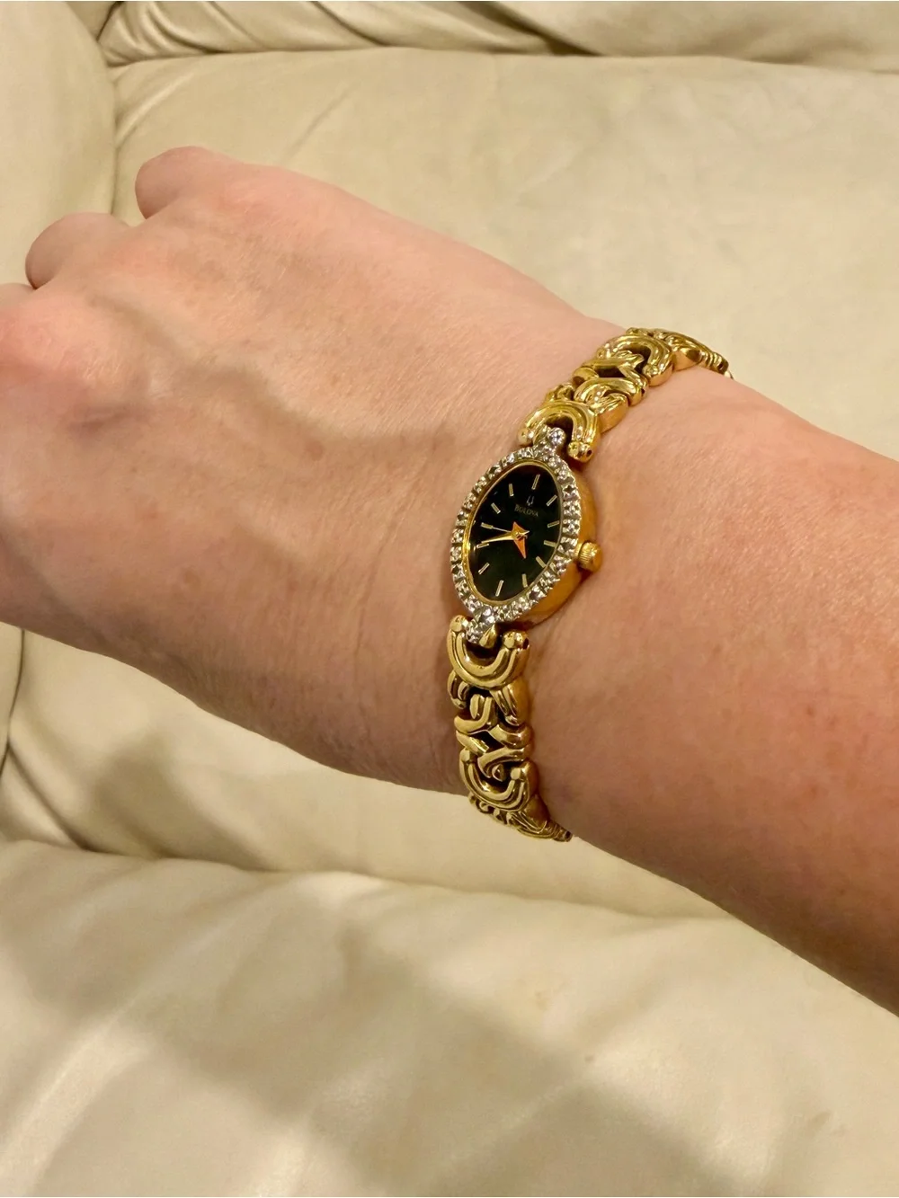 Bulova Gold Tone Dainty Oval Wristwatch Black Dial Textured Bezel Link Bracelet